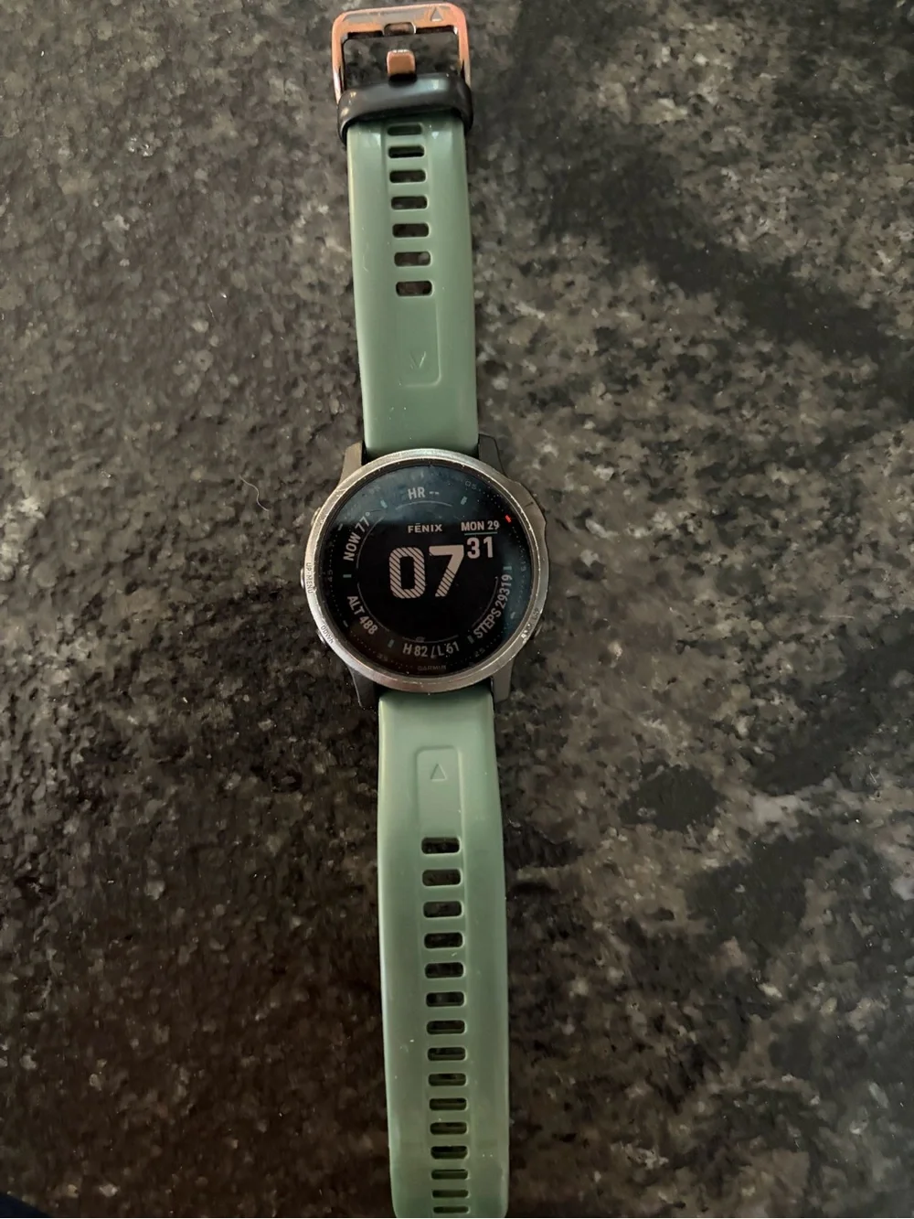 garmin Fenix Smartwatch with Green Silicone Band and Black Bezel